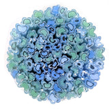 The image is a circular arrangement of various shades of blue and green glass or ceramic shapes, creating a visually striking and abstract composition.