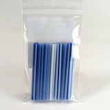 A clear plastic bag containing a collection of blue and white plastic straws.