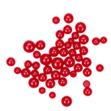 numerous red, round objects scattered across a white background.