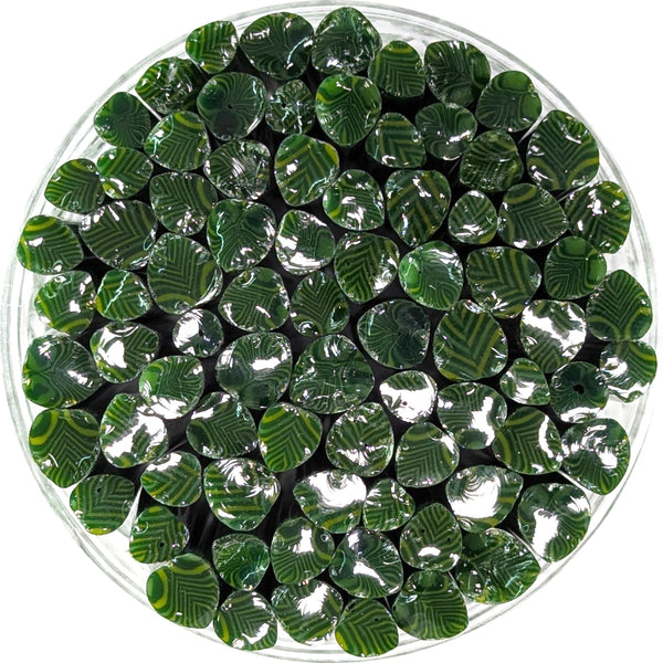 a circular arrangement of numerous green and yellow beads, creating a visually striking and vibrant display.