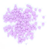numerous small, round, and shiny purple beads scattered across a white background.