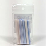 A clear plastic package containing a set of blue and white straws.