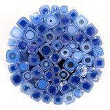 a circular arrangement of numerous blue and white glass rods or rods, creating a visually striking and intricate design.