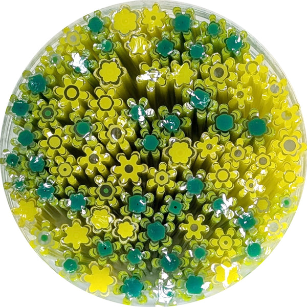 The image is a circular arrangement of yellow and green flower-shaped objects, possibly made of plastic or other materials.
