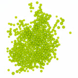 a large pile of bright green, spherical objects scattered across a white background.