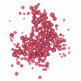 numerous red spheres scattered across a white background.