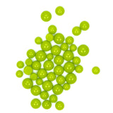 a collection of bright green spheres or beads arranged in a scattered pattern on a white background.