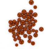 a collection of brown, round objects scattered across a white background.