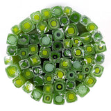 a circular arrangement of numerous green and yellow glass beads, creating a visually striking and vibrant display.