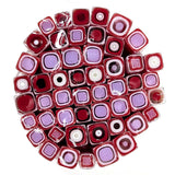 a circular arrangement of various colored glass rods, including red, purple, and white, creating a visually striking and vibrant display.