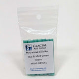 A package of Murrine Sticks, a type of glass, with a label indicating it is made in Portland, Oregon and contains green glass.