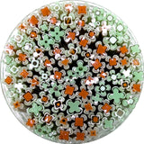 The image is a circular arrangement of various colored straws, including green and orange ones, creating a visually interesting and vibrant display.