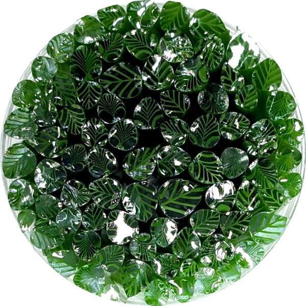 a circular arrangement of green leaves and small circular objects, creating a visually appealing and intricate design.