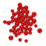 a collection of red, round objects scattered across a white background.