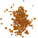 numerous small, round objects that appear to be made of a shiny, golden material. They are scattered across a white background, creating a visually striking contrast.