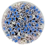The image is a circular arrangement of various colored glass shapes, including shades of blue, white, and pink, creating a visually striking and abstract composition.