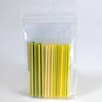 A clear plastic bag containing a collection of yellow and green straws.