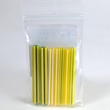 A clear plastic bag containing a collection of yellow and green straws.