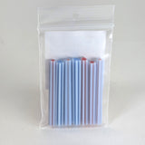 A clear plastic bag containing a group of blue and red straws.