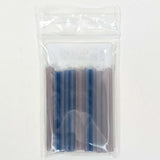 A clear plastic bag containing a group of blue and purple plastic tubes.