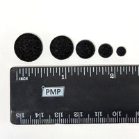 Black ruler with measurement the sizes of the Powder Wafers on a white background