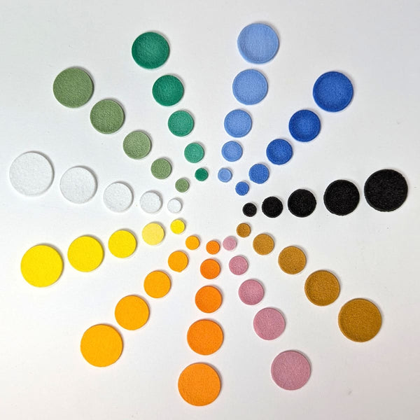 Nine color variations of Glacial Art Glass' fusible glass Circle Powder Wafers in COE 90