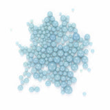 numerous light blue spheres scattered across a white background.