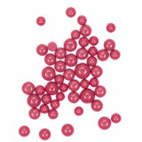 a collection of red, round objects arranged in a scattered pattern against a white background.
