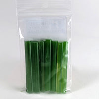 A clear plastic bag containing a group of green plastic sticks or sticks.