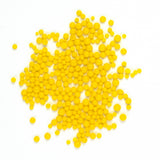 numerous small, round, yellow objects scattered across a white background.