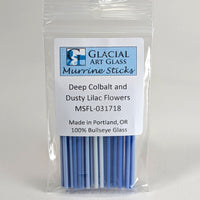 A package of glacial art glass marrine sticks, specifically deep colbal and dusty lilac flowers, made in Portland, Oregon.