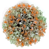 The image is a circular arrangement of multicolored glass or ceramic objects, including orange, green, and black shapes, creating a visually striking and vibrant display.