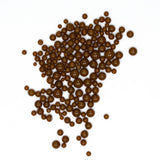 numerous small, round, brown objects scattered across a white background.
